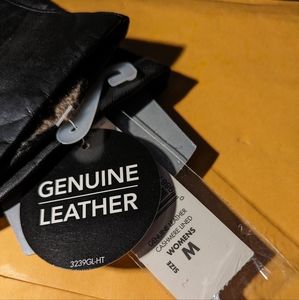 Cashmere lined, black leather gloves.  New with tags.  Medium.